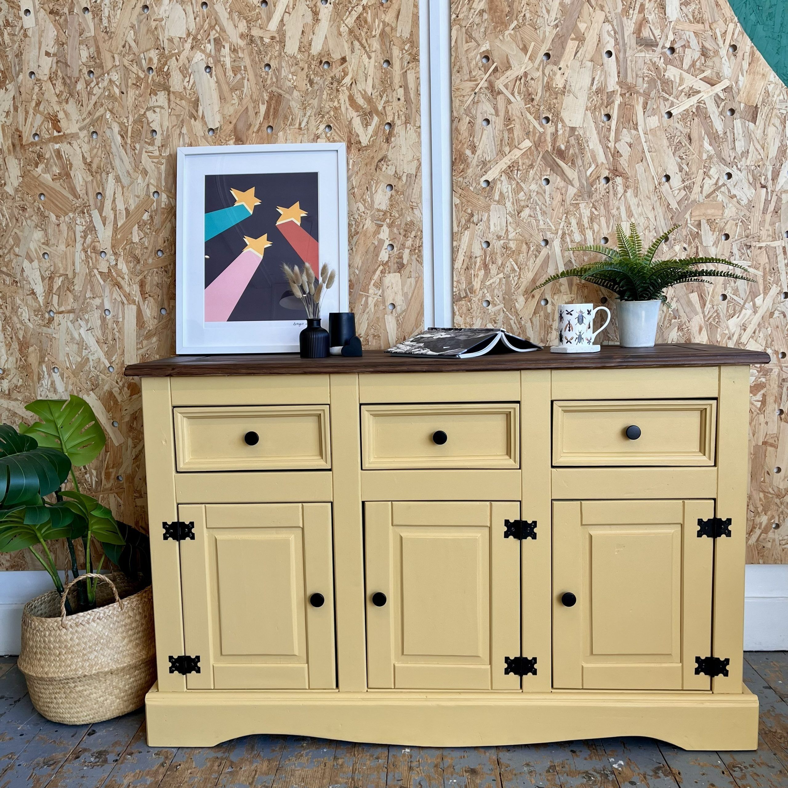yellow sideboard with three cupboards