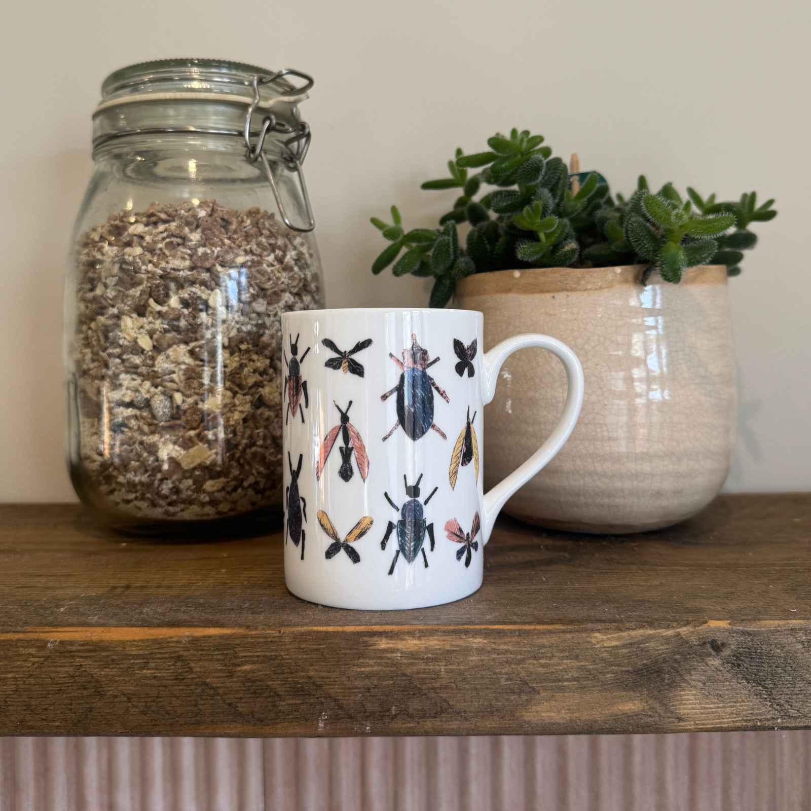 bug mug on shelf