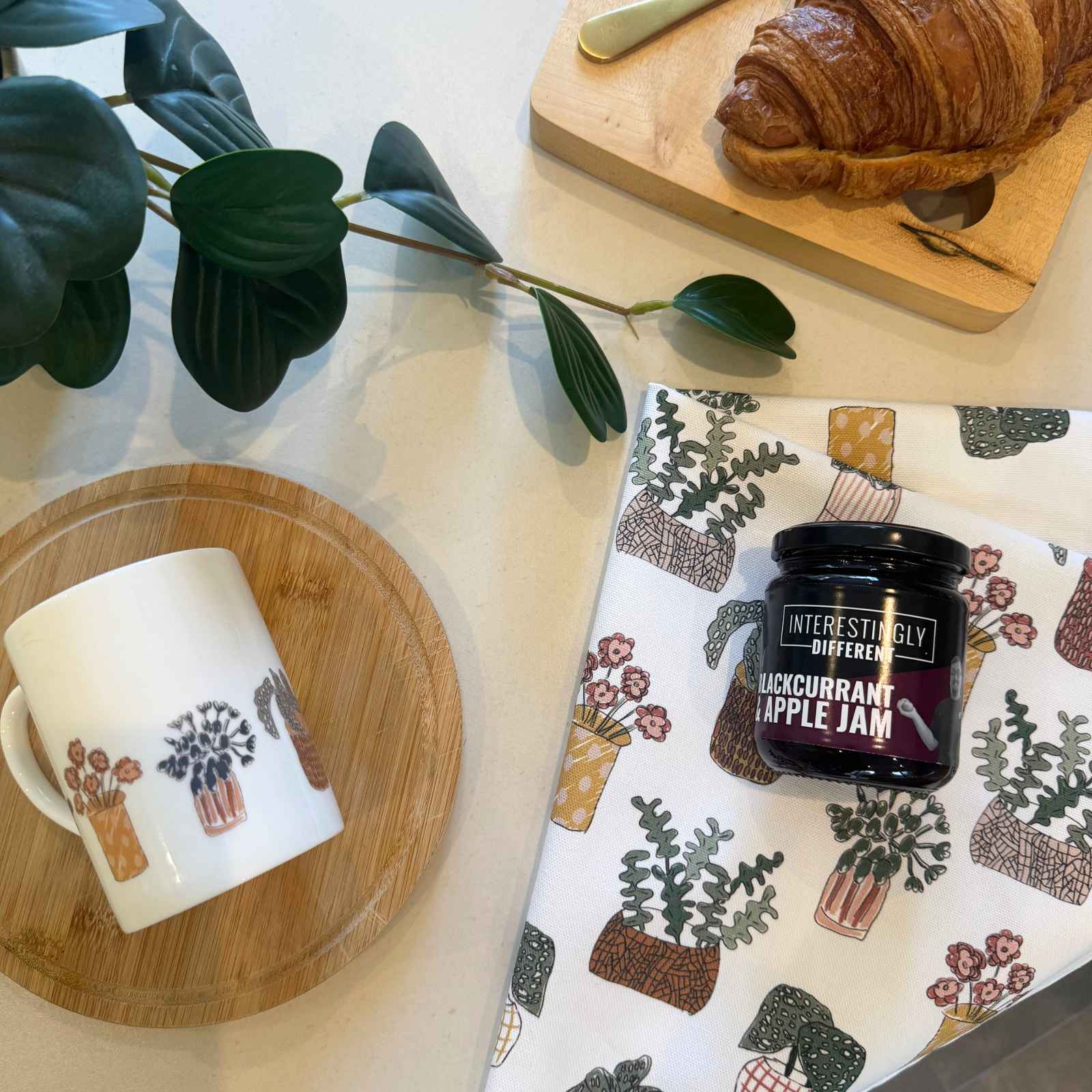 plant print tea towel on table